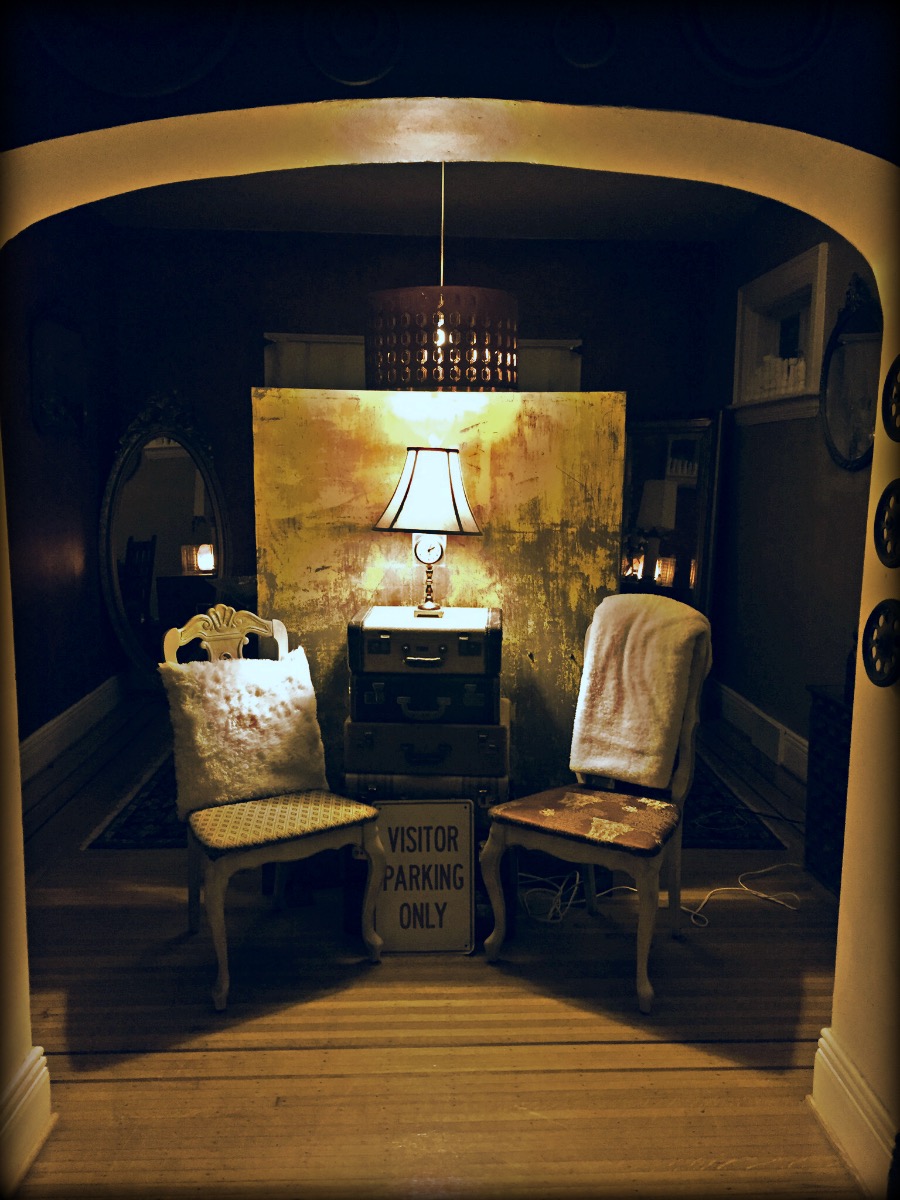 Warmly lit entry with vintage chairs